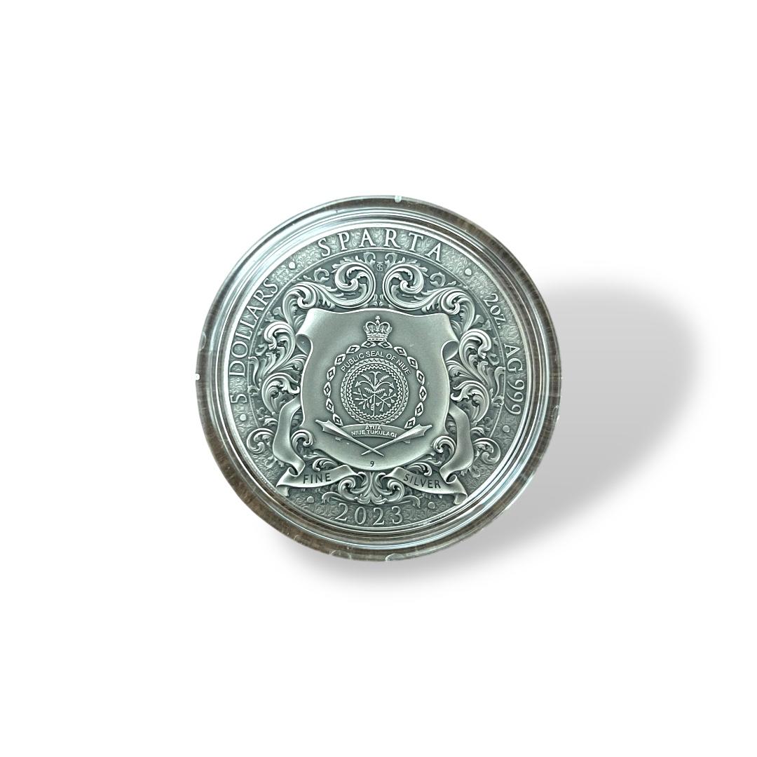 2023 Niue Sparta 1oz Silver Coin – Obverse showing Public Seal of Niue with baroque scrollwork