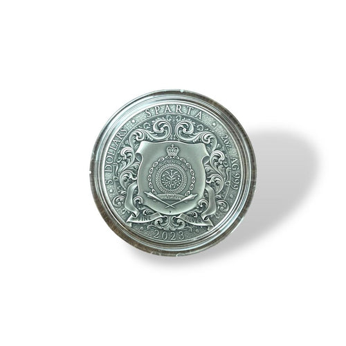 2023 Niue Sparta 1oz Silver Coin – Obverse showing Public Seal of Niue with baroque scrollwork